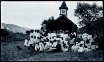 Priest and parishioners in front of Saint Ann Church, Waihee, Maui.